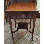 An Edwardian mahogany envelope card table with drawer to front and green baize and four recessed