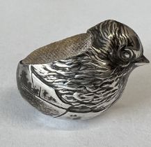 A Sampson Mordan silver pin cushion in the form of a hatching chick. Hallmarked Chester 1908.