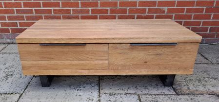 An oak coffee table with two drawers to the front. 43cm h x 120cm w x 60cm d.