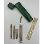 An early 19thC shagreen cased draughtsman’s compass set with white metal mounts. 14cm h. Ivory ruler