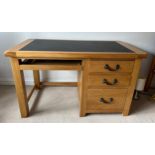Oak kneehole desk with 3 drawers to side and leather top 78cm h x 130cm w x 67cm d.