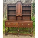 An early 20thC solid oak high back dresser in the Georgian style. Two drawers to the base, the