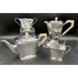 A silver Art Deco four piece tea set comprising coffee pot, teapot, twin handled sugar and jug all