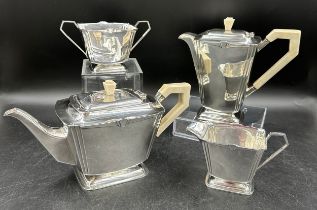 A silver Art Deco four piece tea set comprising coffee pot, teapot, twin handled sugar and jug all