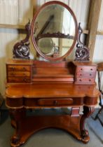 A 19thC mahogany duchess dressing table with three drawers to the top at each side and a well in