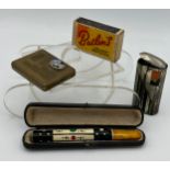 A good quality cheroot holder 11cm l with amber mouthpiece in original fitted leather box,