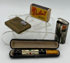 A good quality cheroot holder 11cm l with amber mouthpiece in original fitted leather box,