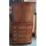 A yew wood cabinet 2 doors over 4 drawers 130h x 61w x 39cm d.