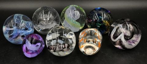 Collection of eight Caithness paper weights to include a pig, a ram's head and six other brightly