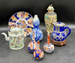 A selection of various oriental ceramics to include a teapot 14cm h, lidded jug, lidded vase 27cm h,