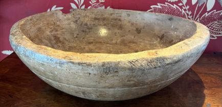A treen beech wood dough bowl, circa 1800, 45cm d.