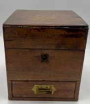 A 19thC mahogany medicine chest, complete with bottles, scales, weights, glass pestle and mortar
