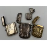 Four vesta cases, two hallmarked silver, Birmingham 1919, Birmingham 1886, a sterling silver case