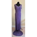 A bias cut beaded 1930s evening gown with train, unlined, plunge neckline at back v neck to front.