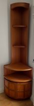 A teak Parker Knoll corner cupboard with light to top, shelves and cupboard to base. 195cm h x