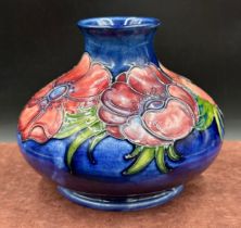 Anemone pattern Moorcroft vase. 12cm h. 5cm d at top.