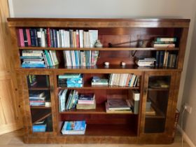 A mahogany bookcase with shelves and two cupboards. Approximately 193cm l x 160cm h x 30cm d.