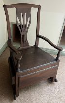 A late 18thC elm nursing chair with rockers and drawer to one side. 89cm h.