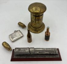 Brass and other metal items to include pig vesta case, bottle lighter, letter box money box 11cm