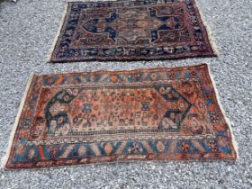 Two vintage wool rugs, largest blue and brown smallest red and blue. 110 x 210cm. largest 150 x