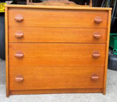 A mid 20thC teak Stag chest of four drawers. 76cm w x 43cm d x 67cm h.