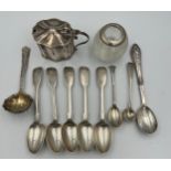 A quantity of hallmarked silver spoons, various dates and makers, a mustard pot with blue glass