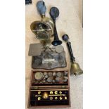 An assortment of brass weights, postal scales, Sikes Hydrometer, brass handbell, brass car horn, a