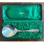 A Tiffany Olympian pattern sterling silver spoon in the original silk lined box. Import mark