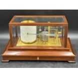 Russell Norwich Scientific Instruments Ltd aneroid barograph raised in mahogany case, bevelled glass