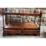 A 20thC two height yew wood coffee table with 2 drawers to base with glass top 57h x 86w x 46cm.