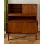 A mid 20thC teak unit comprising two cupboards, two drawers and a drinks cabinet. 122cm w x 44cm d x