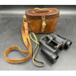 A leather military binocular case stamped Case No 2 Prismatic Binocular J.A.J.& Co Ltd 1916 together