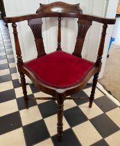 An Edwardian mahogany and inlaid corner chair. Art Nouveau decoration to top rail.