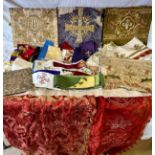 A collection of ecclesiastical fabrics to include stoles, sashes, altar cloth, embroidered panels