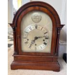 An Edwardian mahogany dome topped chiming mantle clock. 42.5cm h.