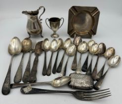 A quantity of hallmarked silver to include cream jug Birmingham 1900, ash tray, vesta case and