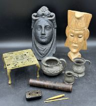 Miscellany to include two masks, one wood, one cast iron approx 30cm h, a brass trivet, three pewter
