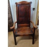 An 18thC Elm high back chair with armrests. Height to back 109, height to seat 39cm.