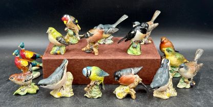 Collection of Beswick birds: blue tit, grey wagtail, 2 x nuthatch, bullfinch, goldcrest,