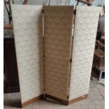 A cream upholstered three fold dressing screen, 145 h and each section 40cm w.