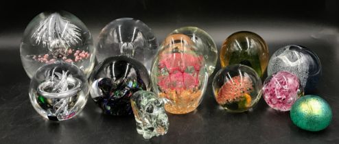 Collection of 12 glass paperweights of varying colours, shapes and sizes, tallest approx 14cm, one