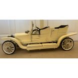 Large model of a Rolls Royce Silver Ghost painted cream and measuring 35cm h x 82cm l.olls Royce