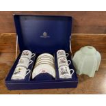 A boxed set of Royal Worcester 6 x coffee cans and saucers depicting flowers
