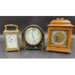 A collection of three clocks to include, a Walker & Hall ltd black lacquered mantle clock with