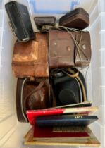 Vintage cameras and booklets to include Advocate Ilford, Agfa, Kodak, some in leather cases.