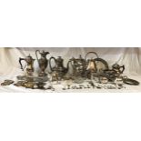 A collection of silverplate items comprising of a large collection of teapots to include an Art