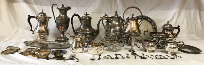 A collection of silverplate items comprising of a large collection of teapots to include an Art