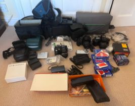 A large collection of cameras to include a Cannon EOS 1000F, Cannon EOS 5000, Minolta LTA & charger,