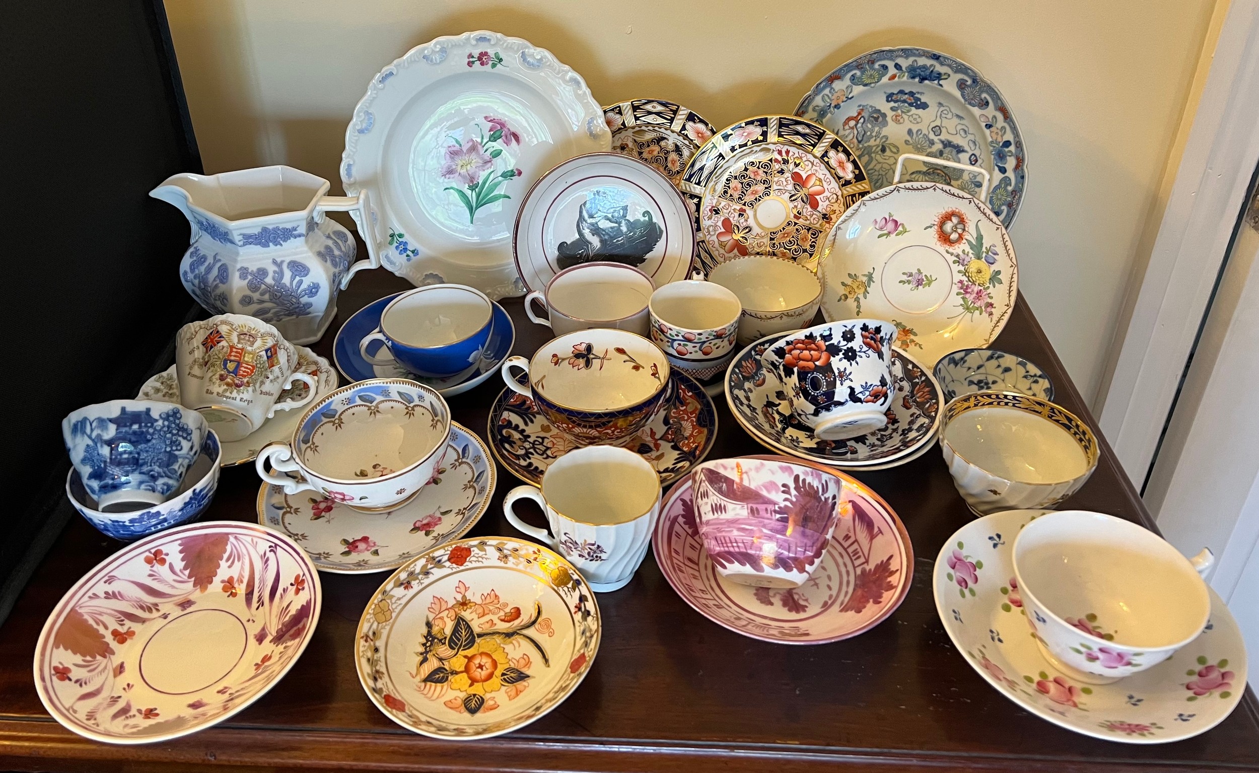 A collection of 18thC and 19thC cups, saucers, plates, jug etc. Various factories to include Bloor