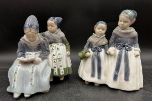 A Royal Copenhagen Porcelain Figure of Amager Girls Reading, 1395 to base, and a pair of girls,